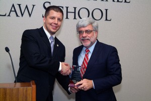 Professor Timothy P. O’Neill is congratulated by Student Bar Association President Michael Reever (left) as the winner of the “Favorite Professor” award after being selected by the evening division students.