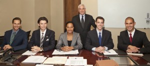 Director Michael Schlesinger (standing) is working with (from left) Ryan DeGrave, Colin Commito, Florence Pittman-Hardy, James Wigoda and Nick Arhos in the newly organized Business Transactions Externship Program.