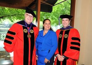 Dean John E. Corkery (left) and Cynthia Sprague congratulate graduate Conor Ferrari McNulty, the 2013 recipient of the Lucy Sprague Public Interest Scholarship.