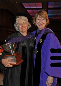 Professor Joanne Simboli Hodge (left) accepts the Dedicated Service Award from Associate Dean Kathryn Kennedy.