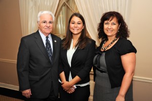Julie Tenuto (center), recipient of the Lupel & Amari Scholarship, is greeted by Leonard Amari, president of The John Marshall Law School Board of Trustees, and Assistant Dean Jodie Needham.