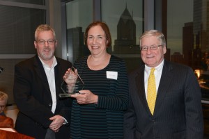 Ellyce Anapolsky, a 2004 alumna, accepts the $50,000 Chicago Bar Foundation /Sun-Times Fellowship from Robert Glaves (left), executive director of CBF, and David Mann (right), chair of the Sun-Times Fellowship Selection Committee.