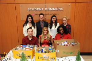 At its holiday party, the Student Bar Association (SBA) accepted canned goods for the needy. SBA officers are (seated, from left) Michael Bradtke, treasurer; Melissa Soso, president; and Maretta Smith, secretary; and (standing, from left) Ashley Charen, evening student liaison; John Chambers, vice president; Kathryn Sodetz, Illinois State Bar Association representative; Colleen Jordan, Chicago Bar Association representative. Harrison Keyes, the American Bar Association representative, is not pictured.