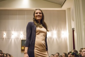 Christina Falkis (JD ’13) shows off a two-tone dress with matching sweater during the fashion show. 