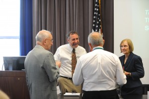 (from left to right) Co-Executive Directors of the Fair Housing Legal Support Center & Clinic, Michael Seng and F. Willis Caruso, and John Marshall professor Susan Connor chat with Tim Iglesias, professor at the University of San Francisco School of Law before his presentation at the conference. 