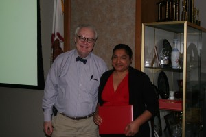 Dean Corkery presents Lisa Aruldoss her award for 10 years of service.